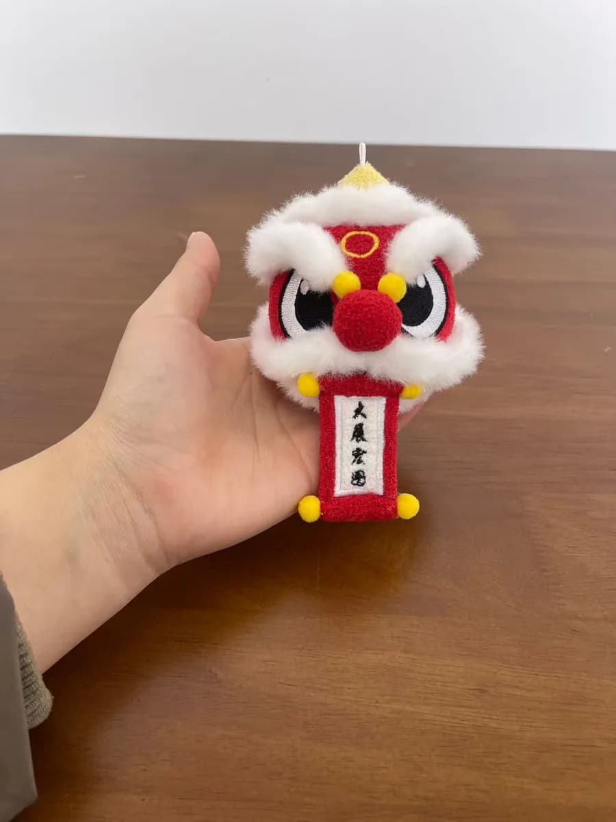 Chinese lion dance plush keychain in red and gold